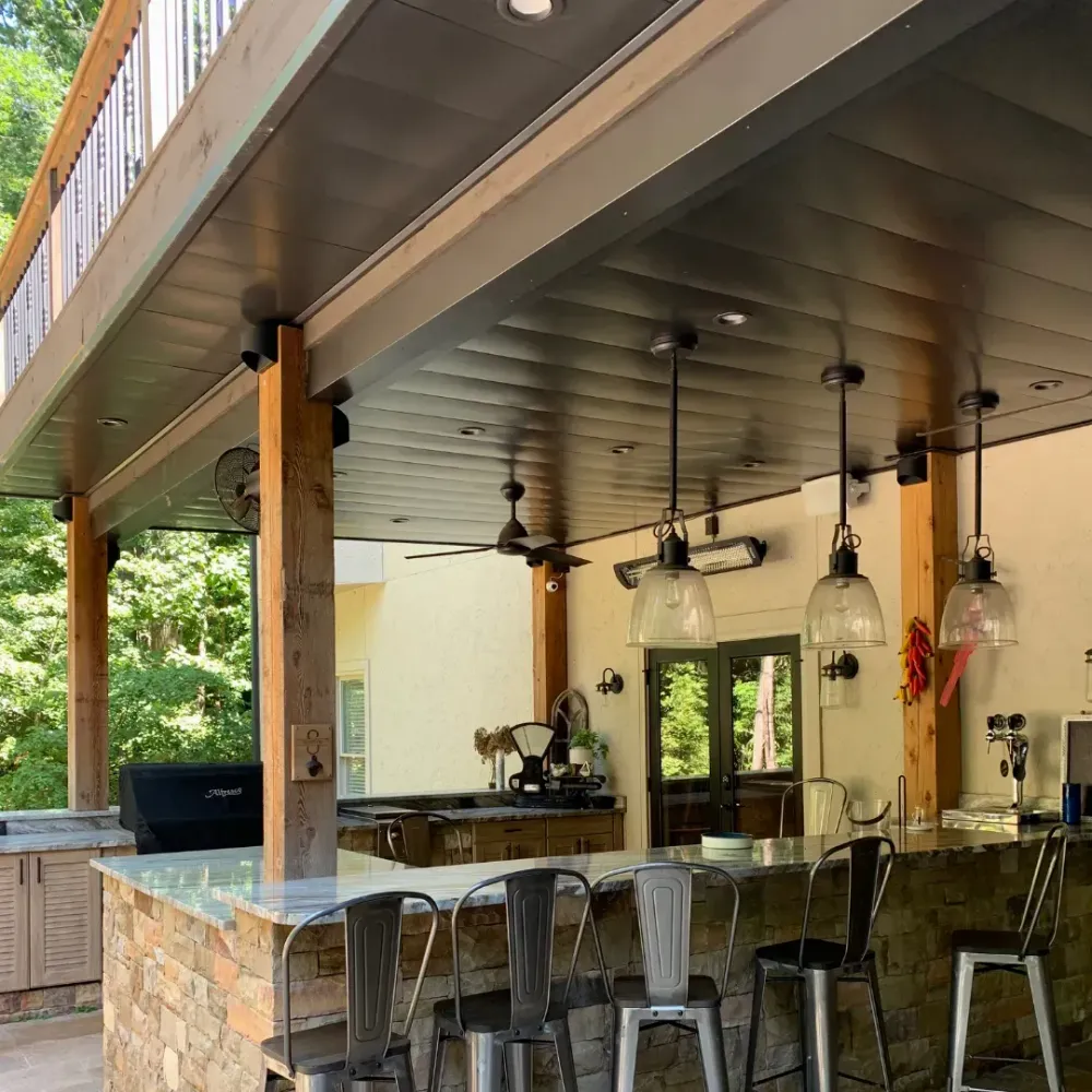 Under deck bar design with added features such as ceiling fans and LED lighting.