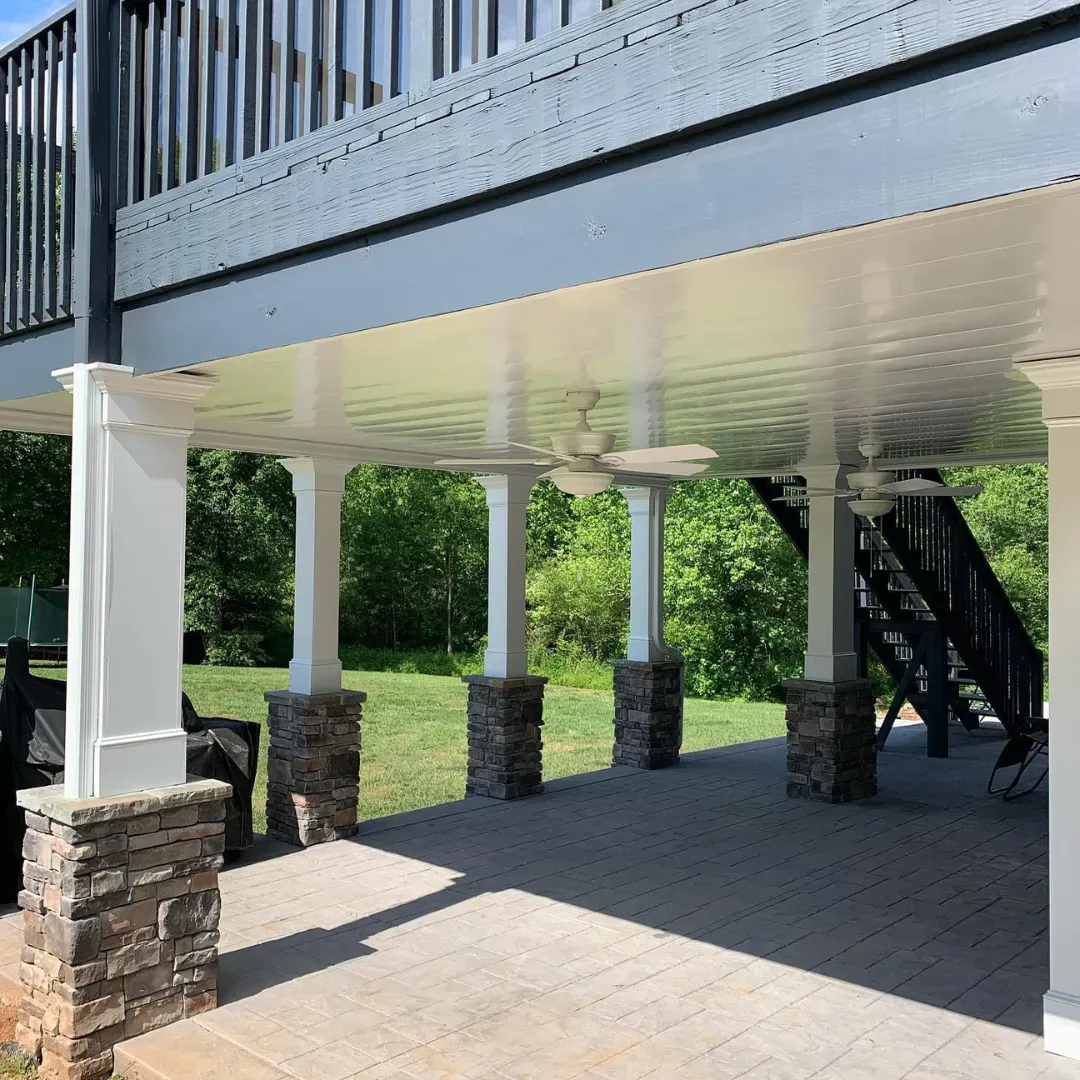 White colored aluminum under deck ceiling installed by Maxi Decks Protection.