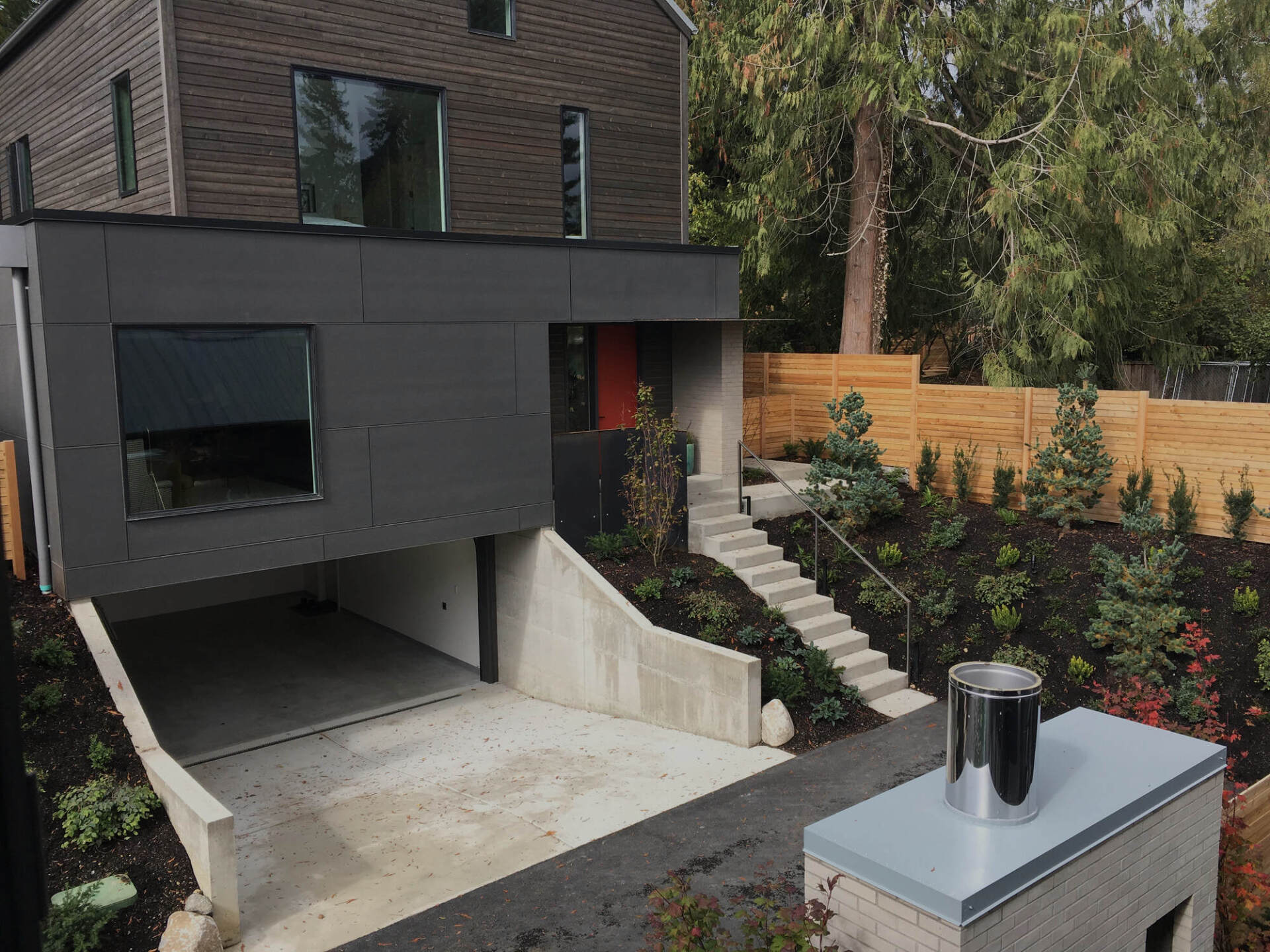A modern house with a garage underneath it