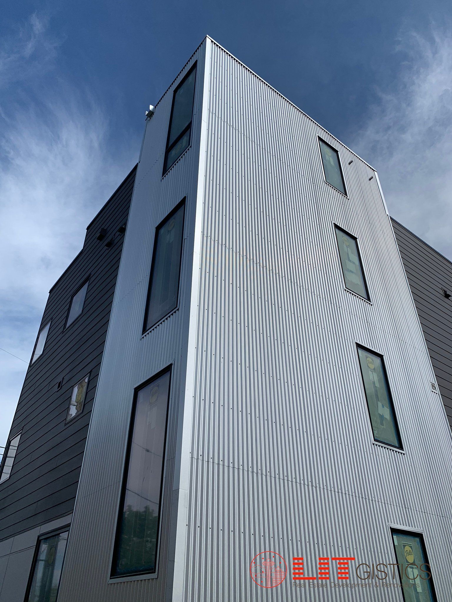 Looking up at a building with a blue sky in the background