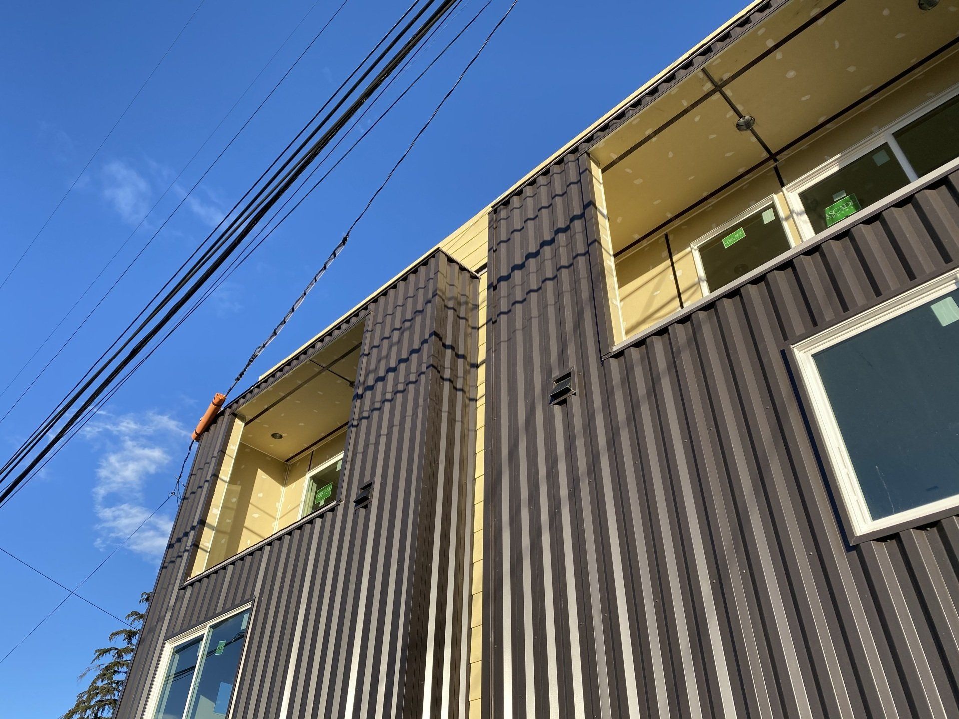 Looking up at a building with a blue sky in the background
