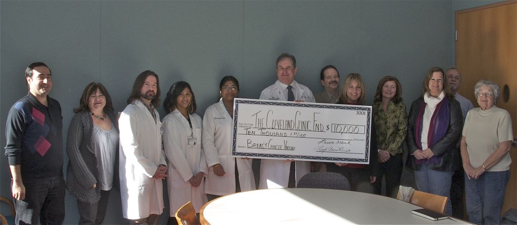 Dr. Tuohy and his research team holding check 2011 Check Presentation | Brakes For Breasts