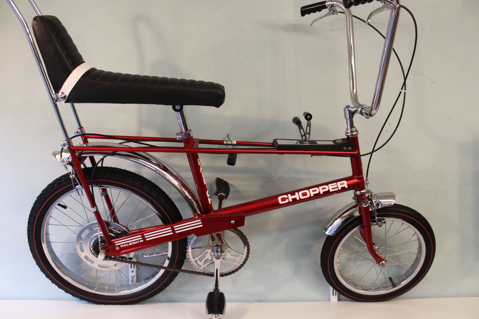burgundy raleigh chopper bicycle