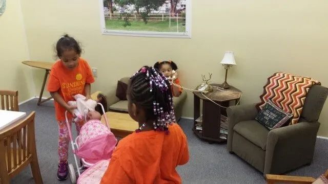 Girls Playing With Doll — York, PA — Sunshine Christian Daycare / Learning Center