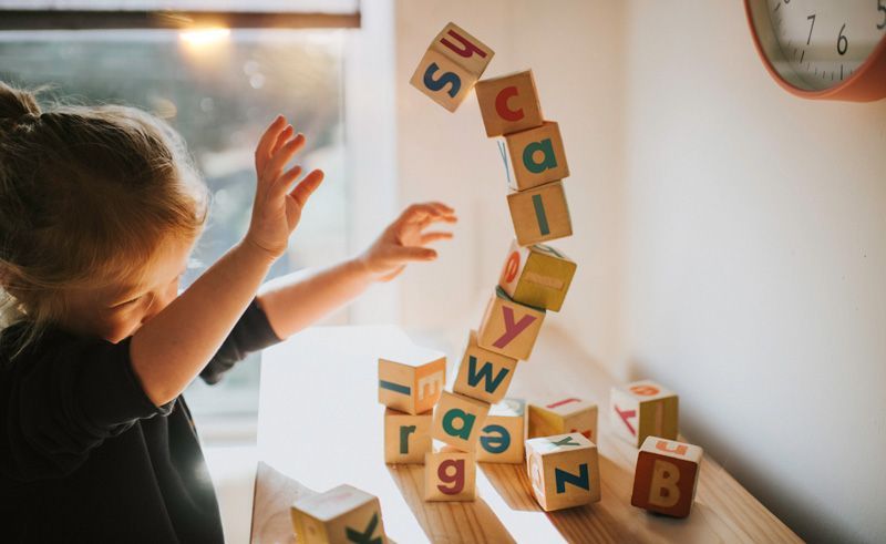 Girl Playing Blocks — York, PA — Sunshine Christian Daycare / Learning Center