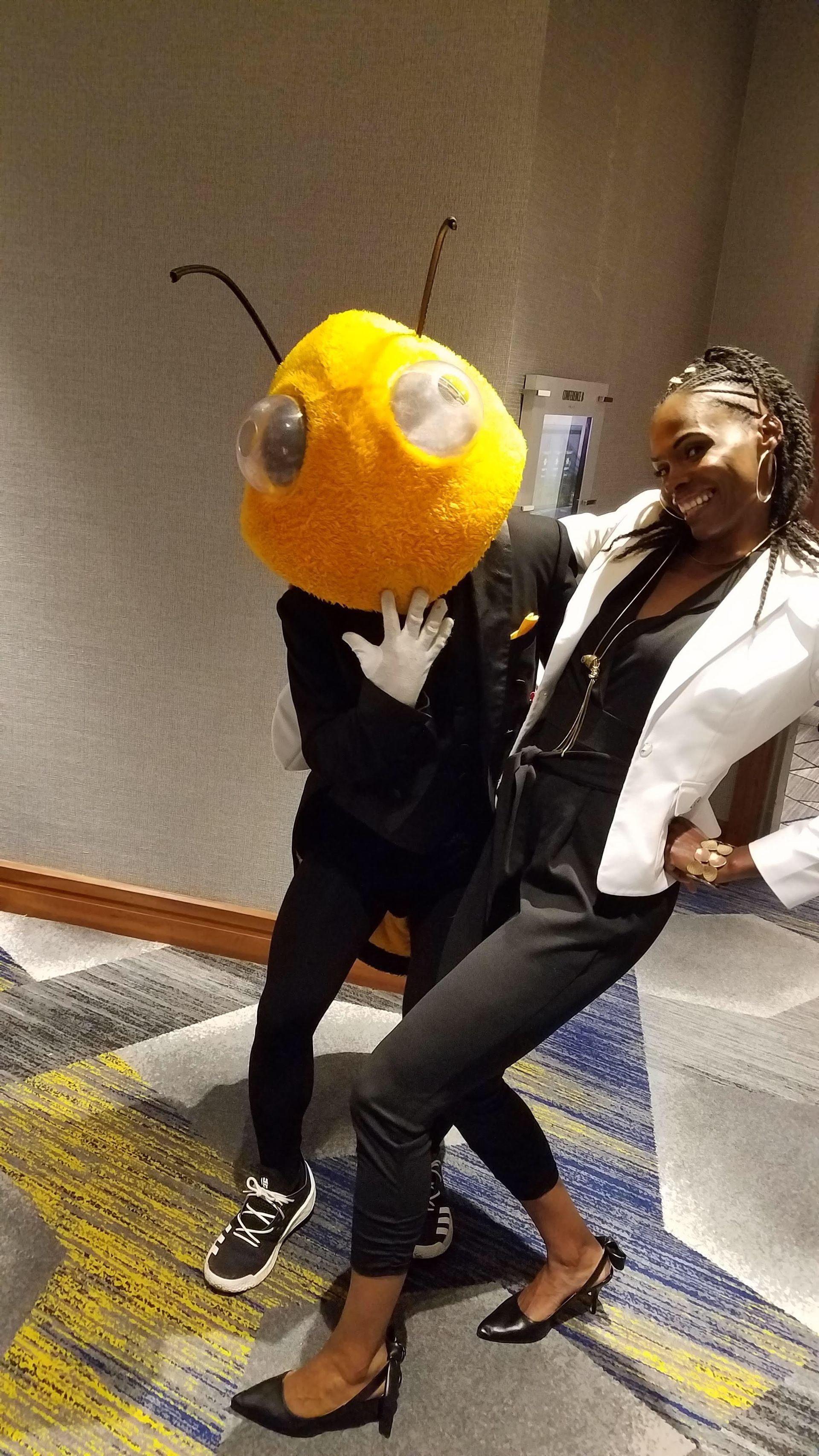 Chaunte Lowe and Georgia Tech Mascot at the 40 under 40 celebration in recognition of her work in resilience and perserverance. 
