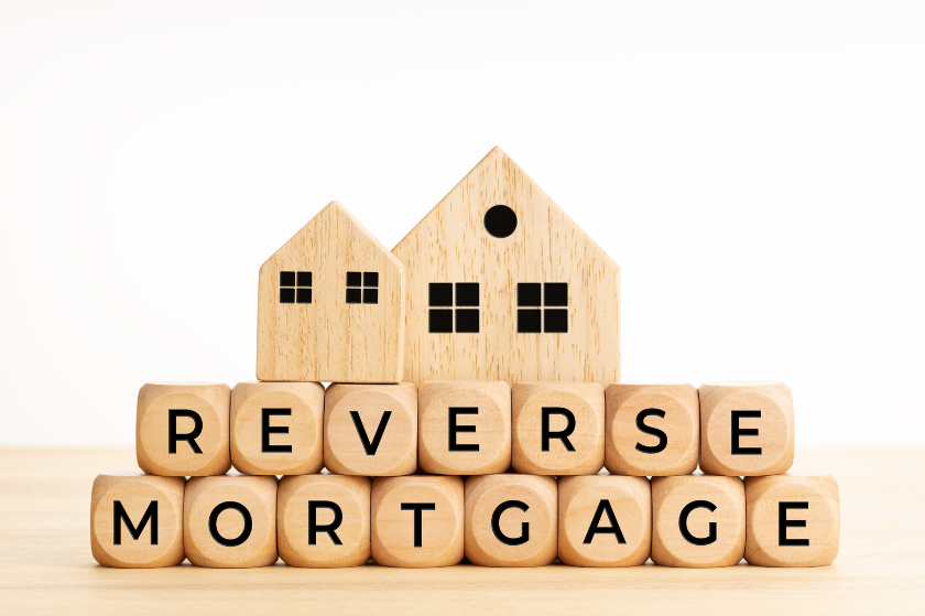The word reverse mortgage is written on wooden cubes