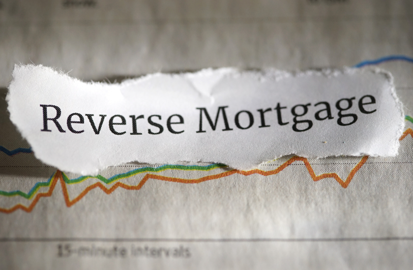 A piece of paper with the word reverse mortgage on it