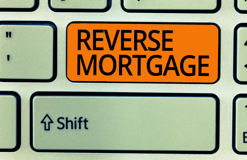 A keyboard with a button that says reverse mortgage