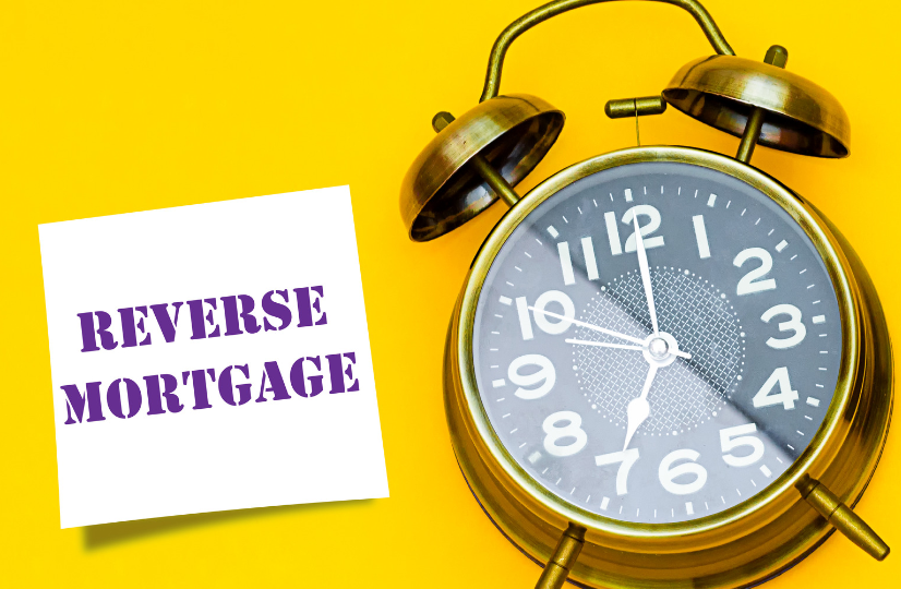 An alarm clock with a note that says reverse mortgage