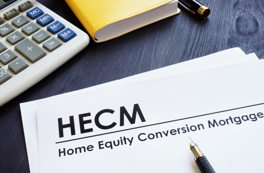 A pen is sitting on top of a piece of paper that says hecm home equity conversion mortgage.