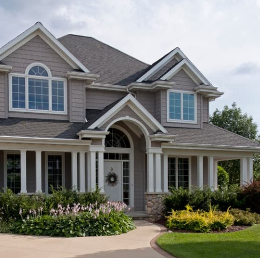 A large house with a wreath on the door