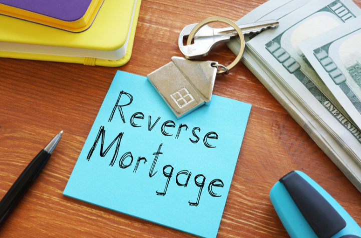 A sticky note with the words `` reverse mortgage '' written on it