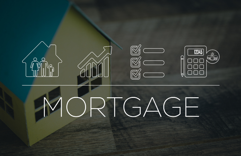 A model house is sitting on a wooden table next to the word mortgage.