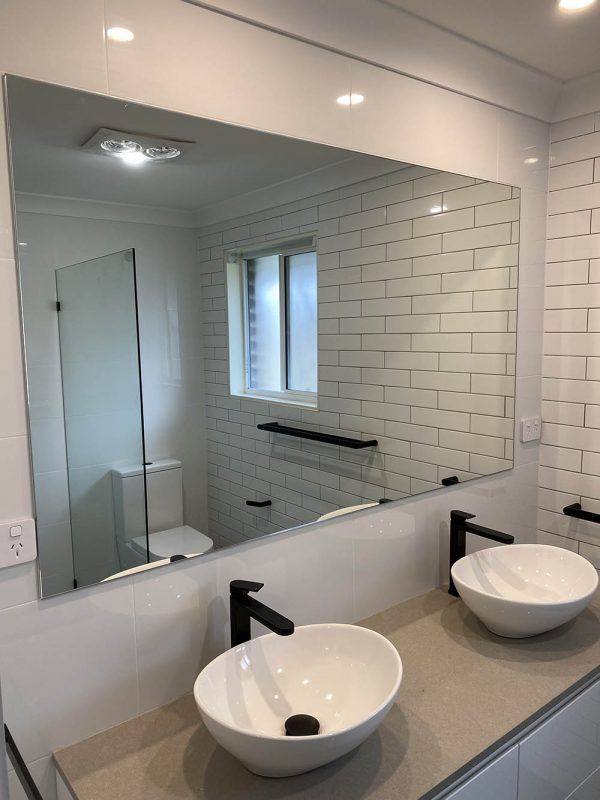 A Bathroom With Two Sinks and a Large Mirror — Reflect Glass In Tuggerah, NSW