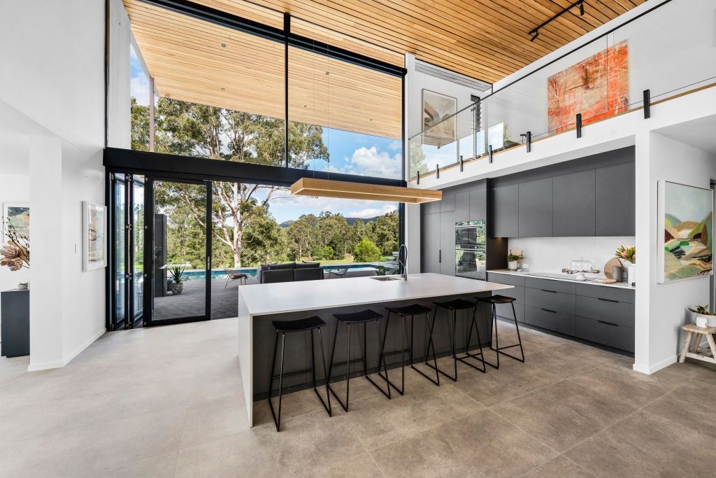 A Man is Installing a Window With Suction Cups — Reflect Glass In Hunter Valley, NSW