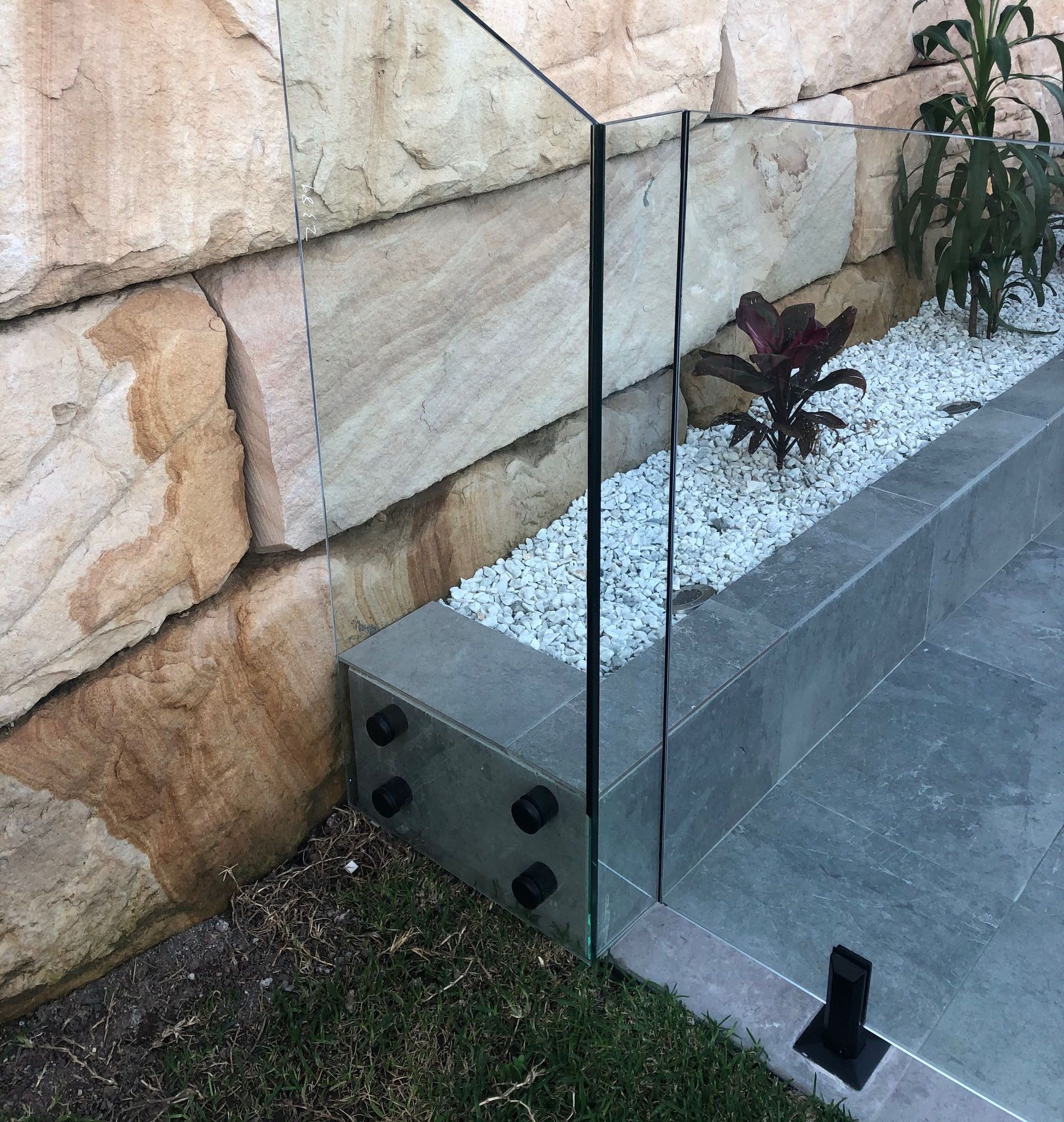 A House With a Balcony and a Glass Railing — Reflect Glass In Lake Macquarie, NSW