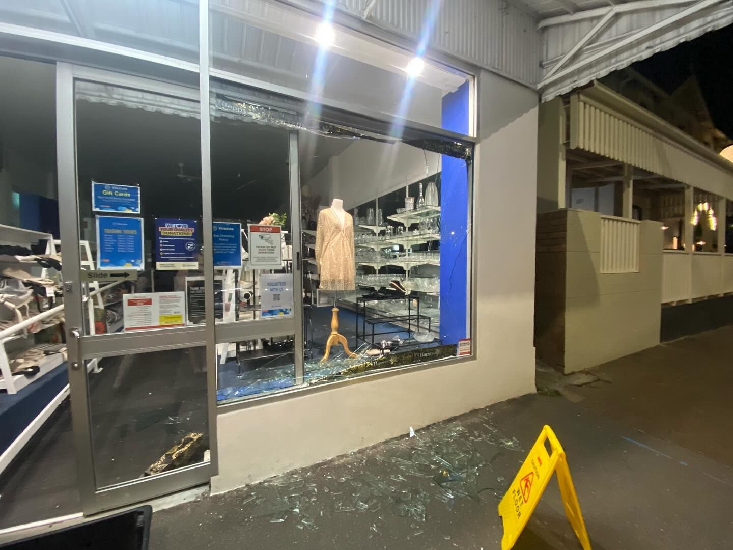 A Store With a Broken Window and a Yellow Caution Sign in Front of It — Reflect Glass In Hunter Valley, NSW