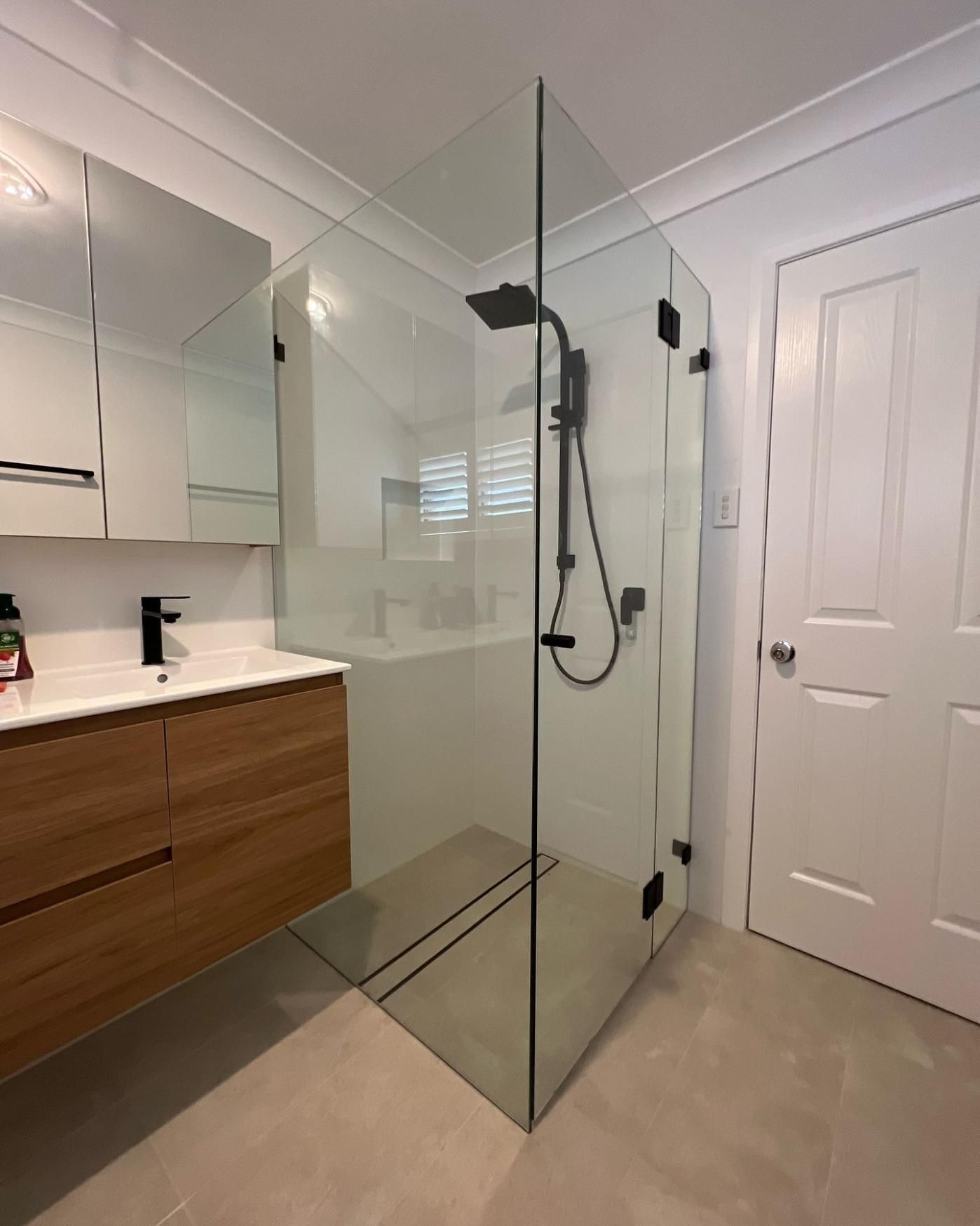 A Bathroom With a Walk in Shower and a Sink — Reflect Glass In Tuggerah, NSW