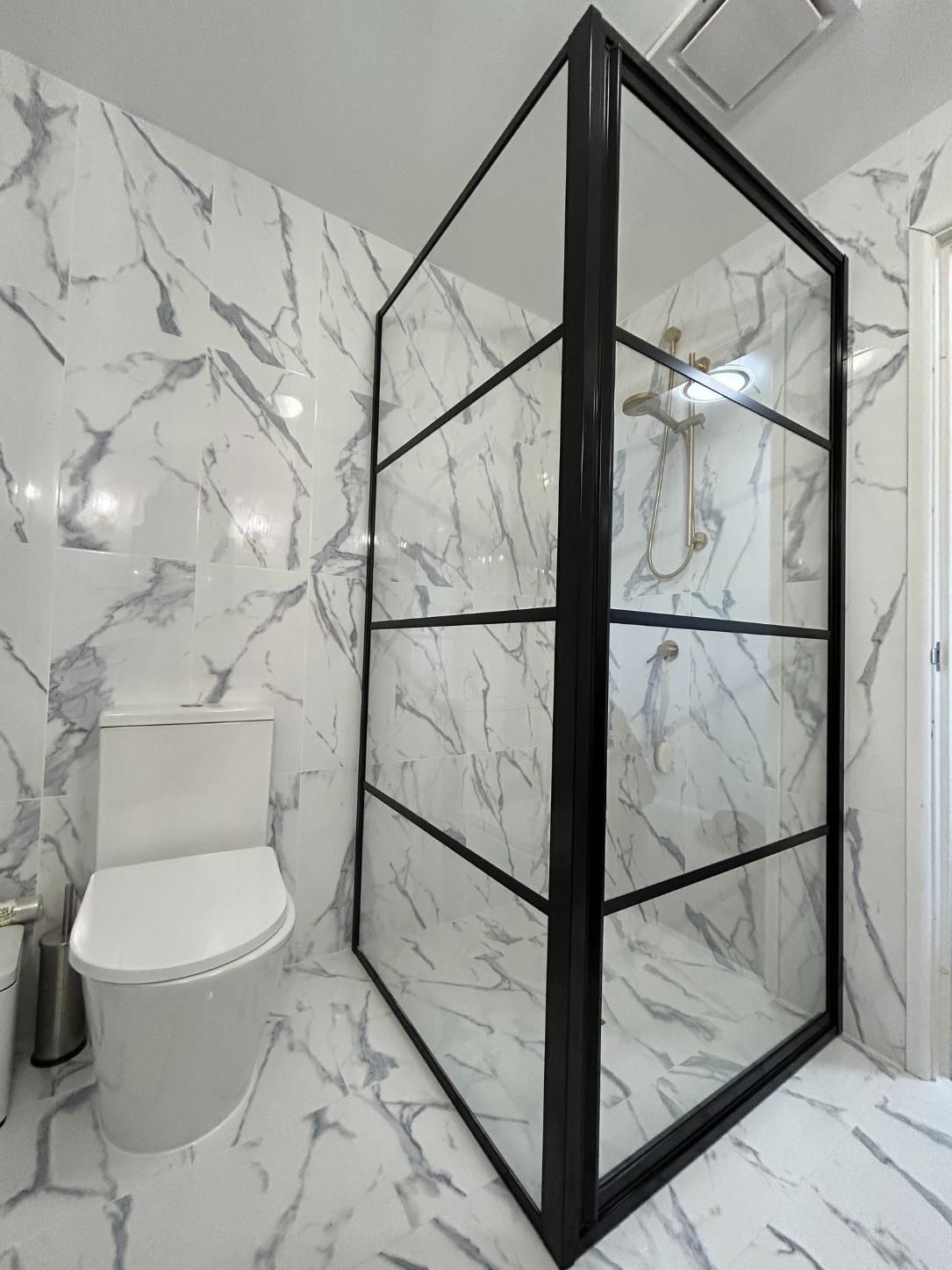 A Bathroom With a Walk in Shower With a Glass Door — Reflect Glass In Woy Woy, NSW