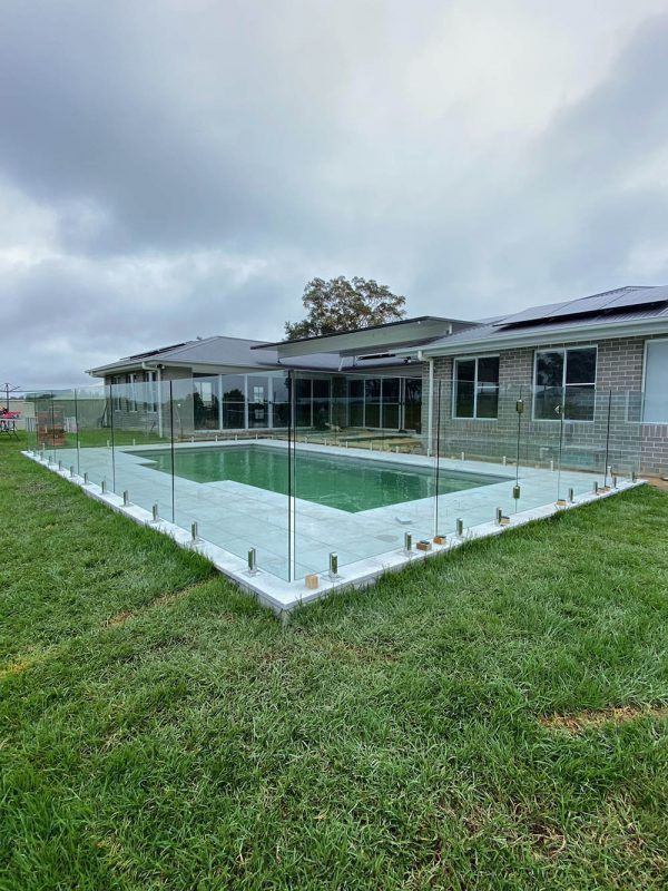 There is a Large Swimming Pool in the Backyard of a House — Reflect Glass In Hunter Valley, NSW