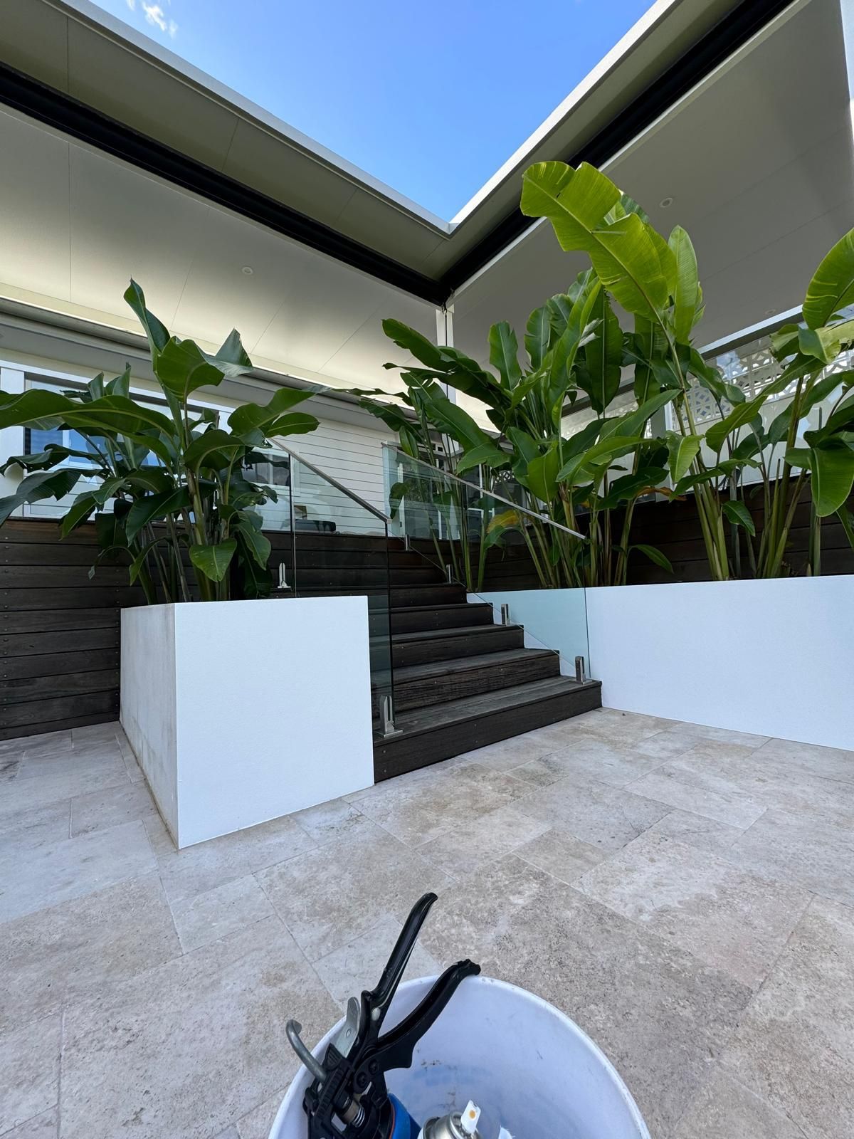 A Wooden Staircase With a Glass Railing and a Stainless Steel Railing — Reflect Glass In Tuggerah, NSW