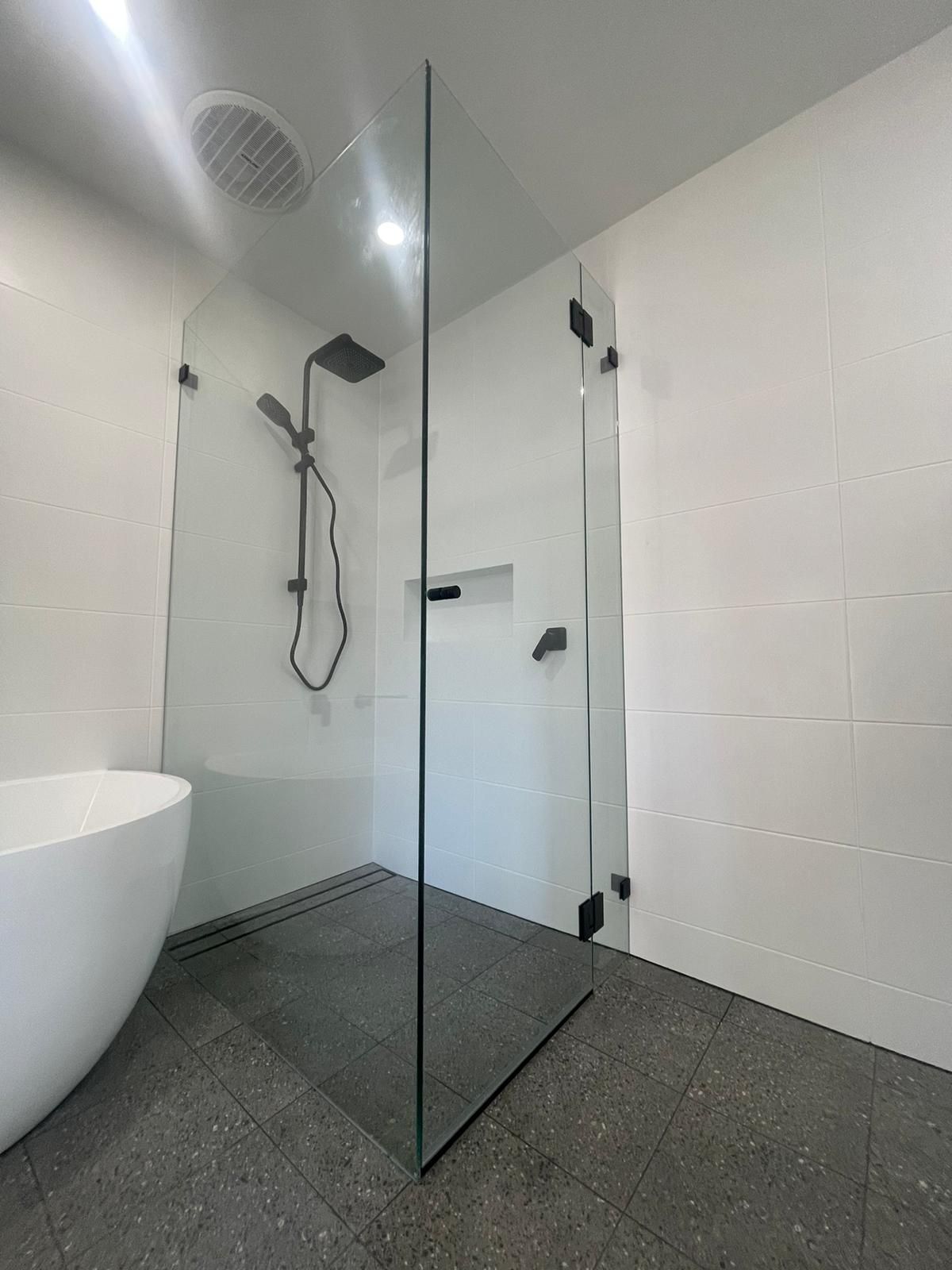 A Bathroom With a Walk in Shower With a Glass Door — Reflect Glass In Tuggerah, NSW