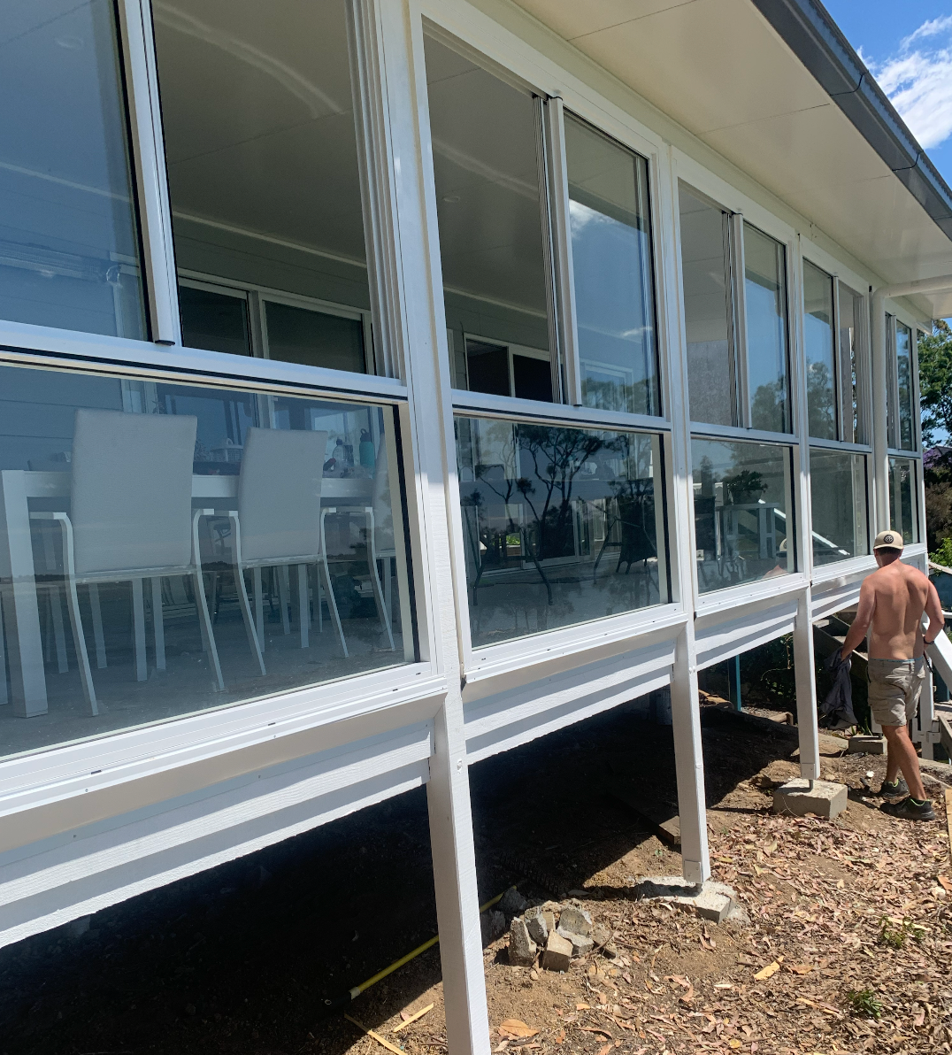 A Close Up of a Window on a Building With Trees in the Background — Reflect Glass In Woy Woy, NSW