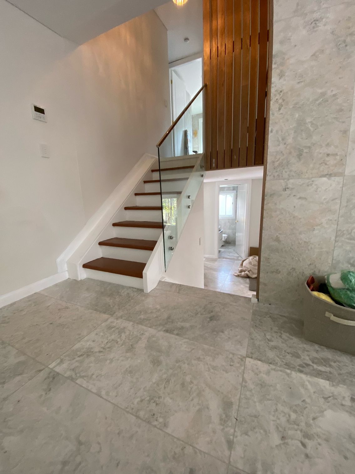 A Balcony With a Glass Railing and Trees in the Background — Reflect Glass In Tuggerah, NSW