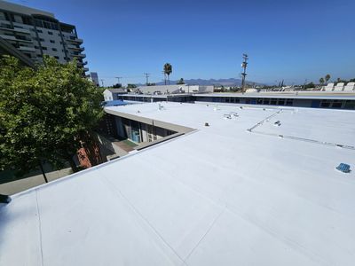 A white roof with a blue sky in the background