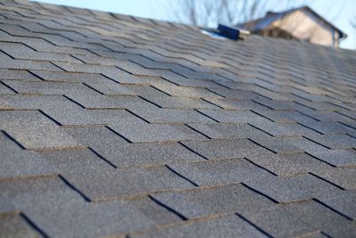 A close up of a roof with shingles on it