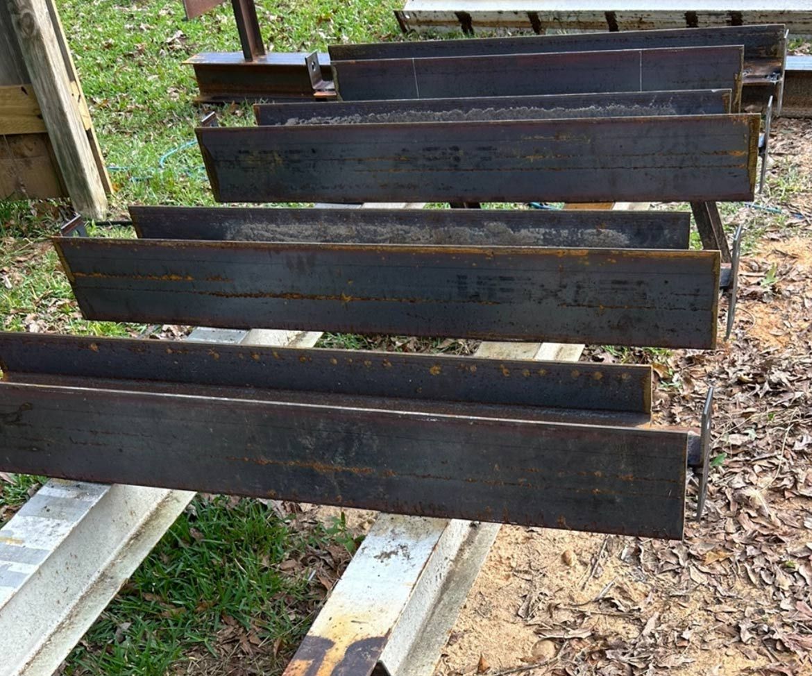 A Bunch Of Metal Pieces Are Stacked On Top Of Each Other