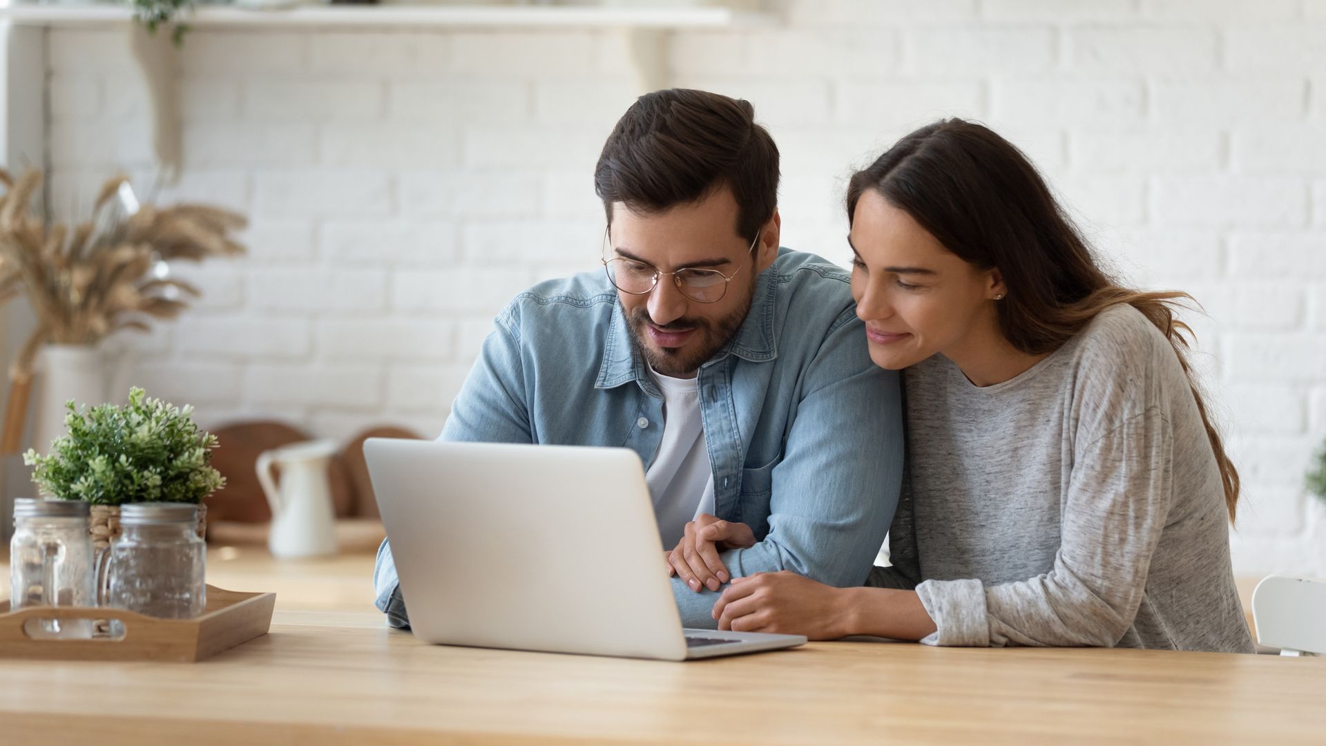 Couple Looking At The Laptop — Dinwiddie, VA — Richard H Avery Insurance Agency Inc.