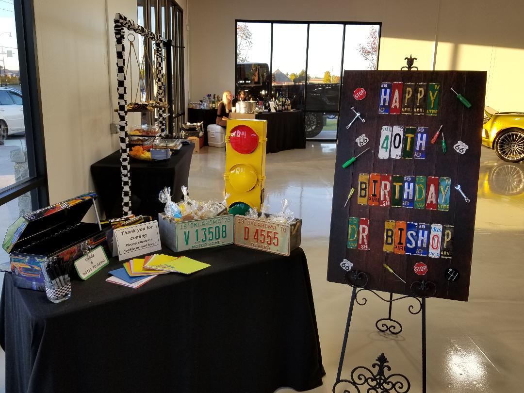 Party decorations for a 40th birthday, including license plate signage and a traffic light.