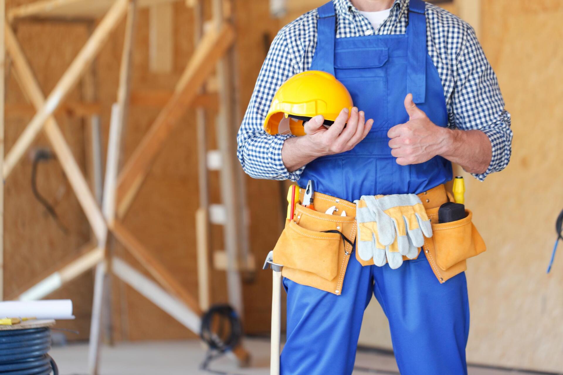 worker holding his helmet