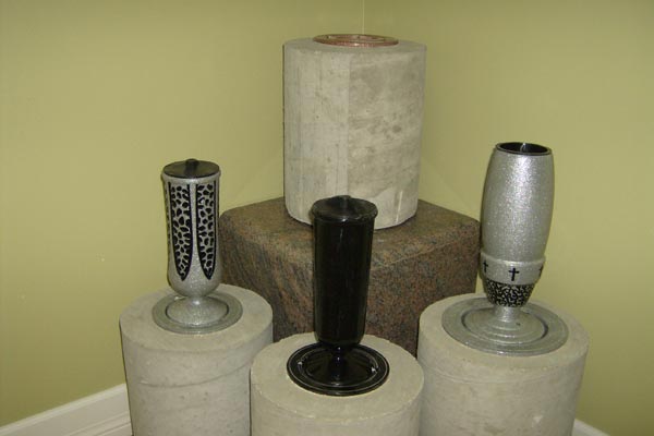 A group of vases are sitting on top of each other on a table.