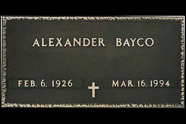 A gravestone for alexander bayco who died on march 16 1994