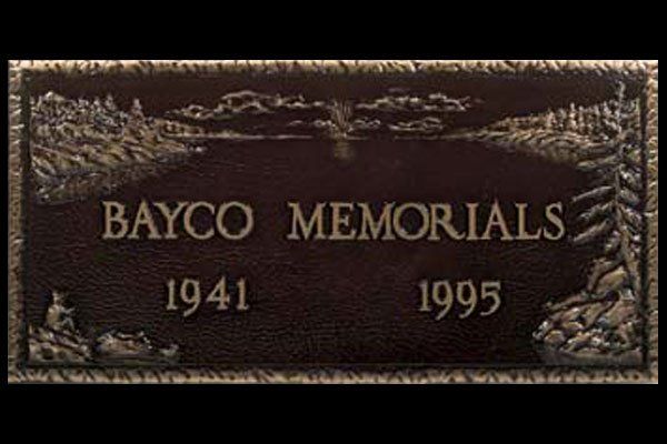A gravestone for bayco memorials from 1941 and 1995