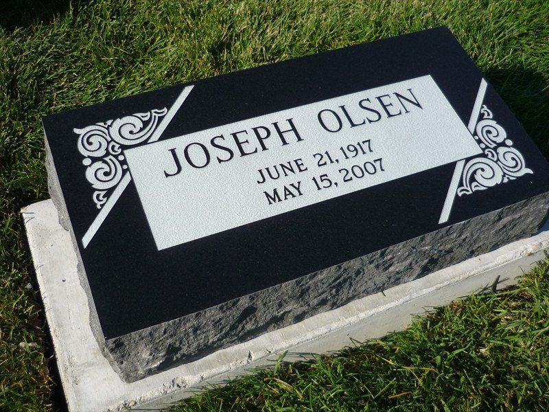 A gravestone for joseph olsen who died on june 21 1917