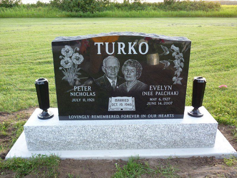 A black gravestone with the name turko on it