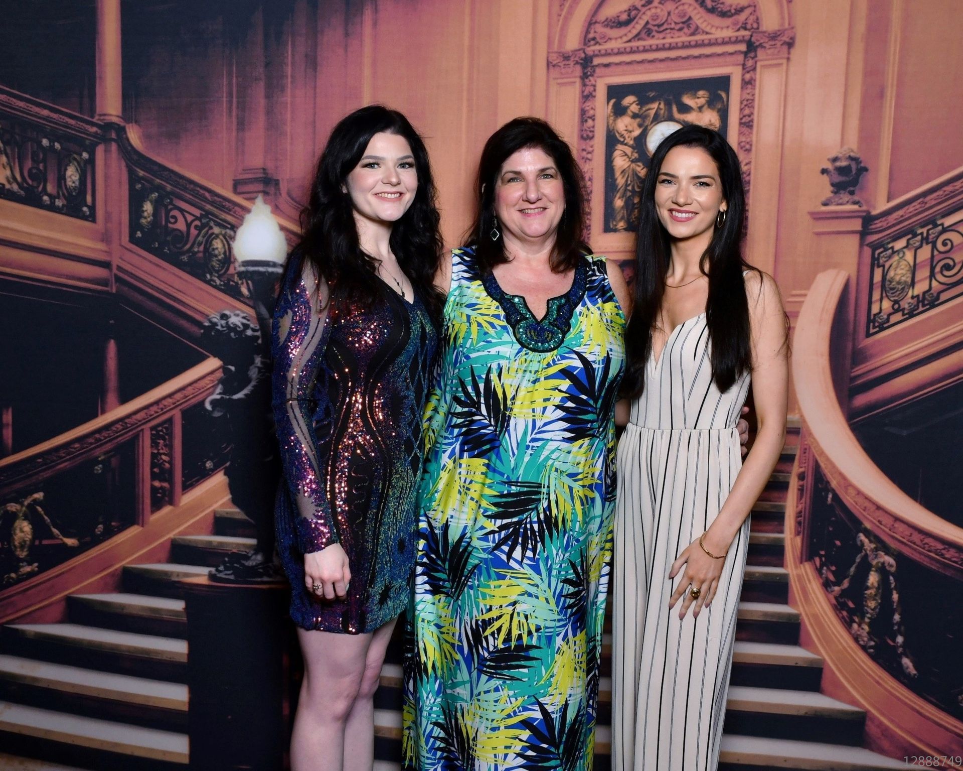 A warm, smiling family photo featuring Debbie Savage and her daughters.
