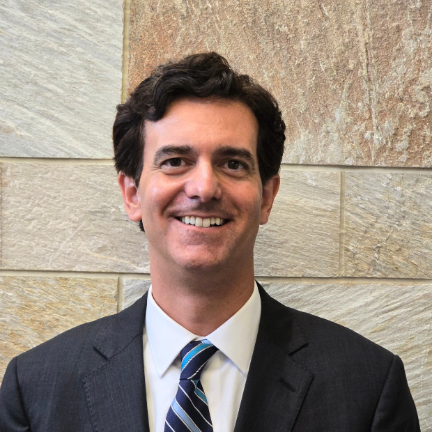 Rev. Dr. Aaron Janklow smiling in a headshot.