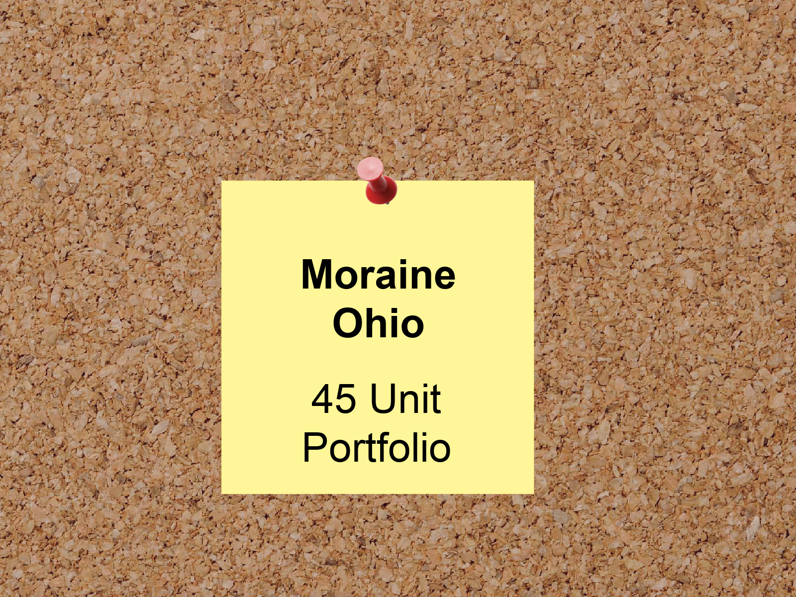 A post it note pinned to a cork board says moraine ohio 45 unit portfolio