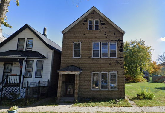 Two houses are next to each other on a sunny day