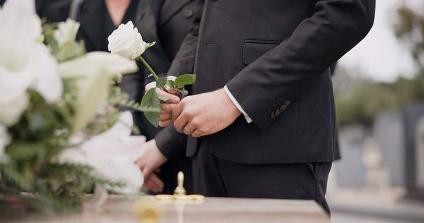 A Bride and Groom Are Kissing on A Dock Next to A Lake — Vivienne Celebrant - Gold Coast Wedding Celebrant in Casuarina, NSW