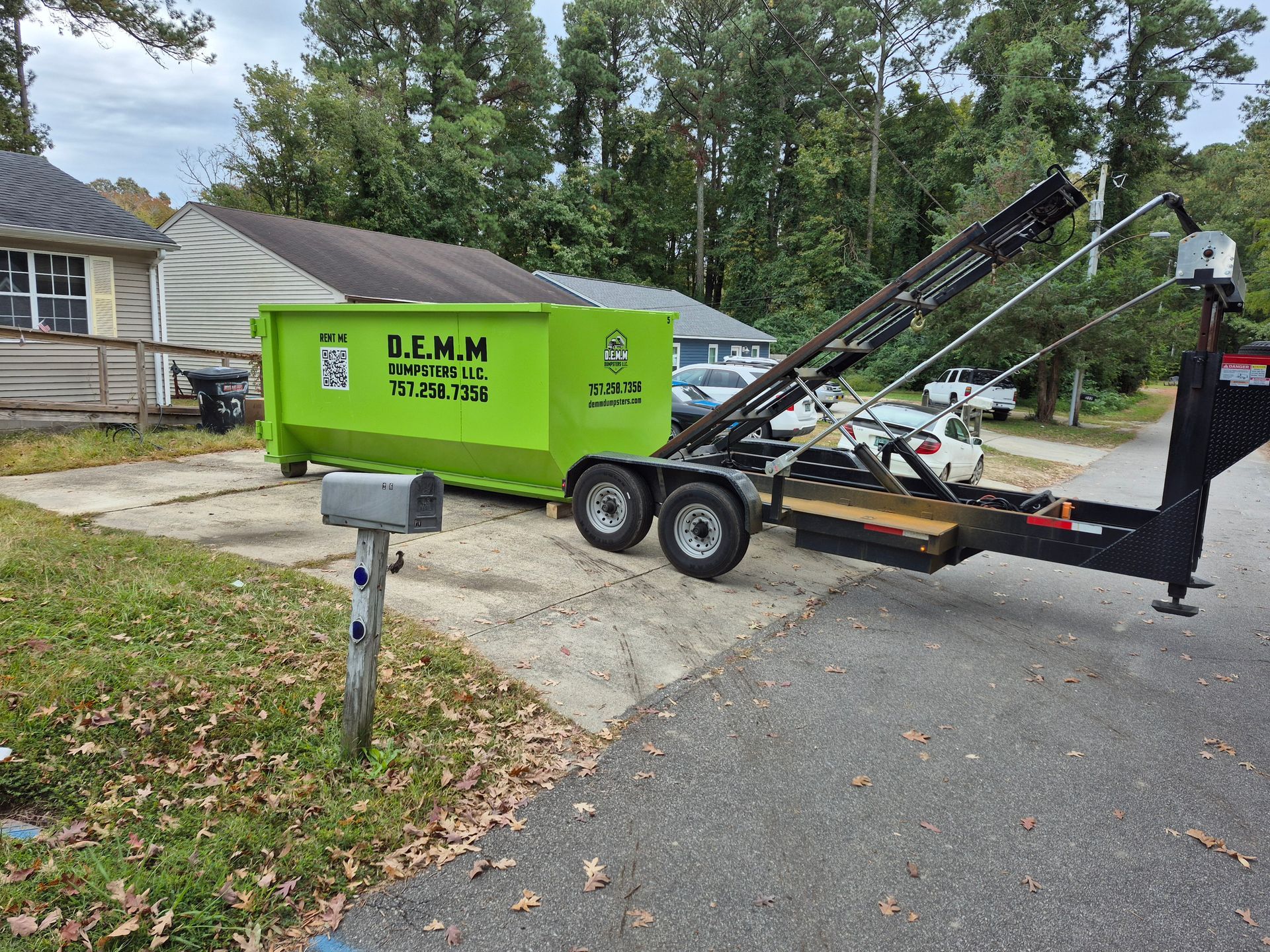 D.E.M.M. Dumpsters delivery truck ready for a Chesapeake VA dumpster rental drop-off