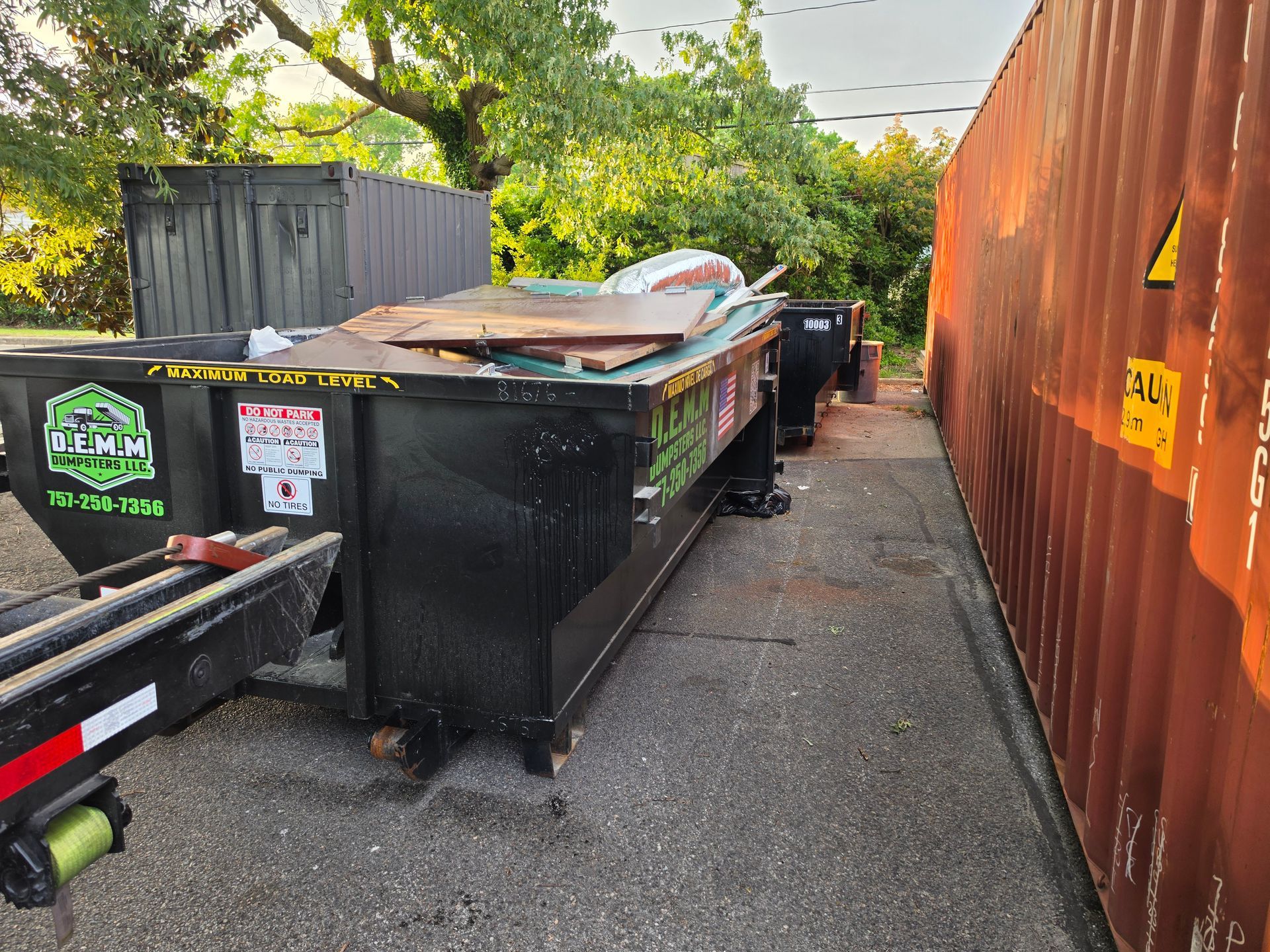 10 yard construction dumpster from D.E.M.M. Dumpsters