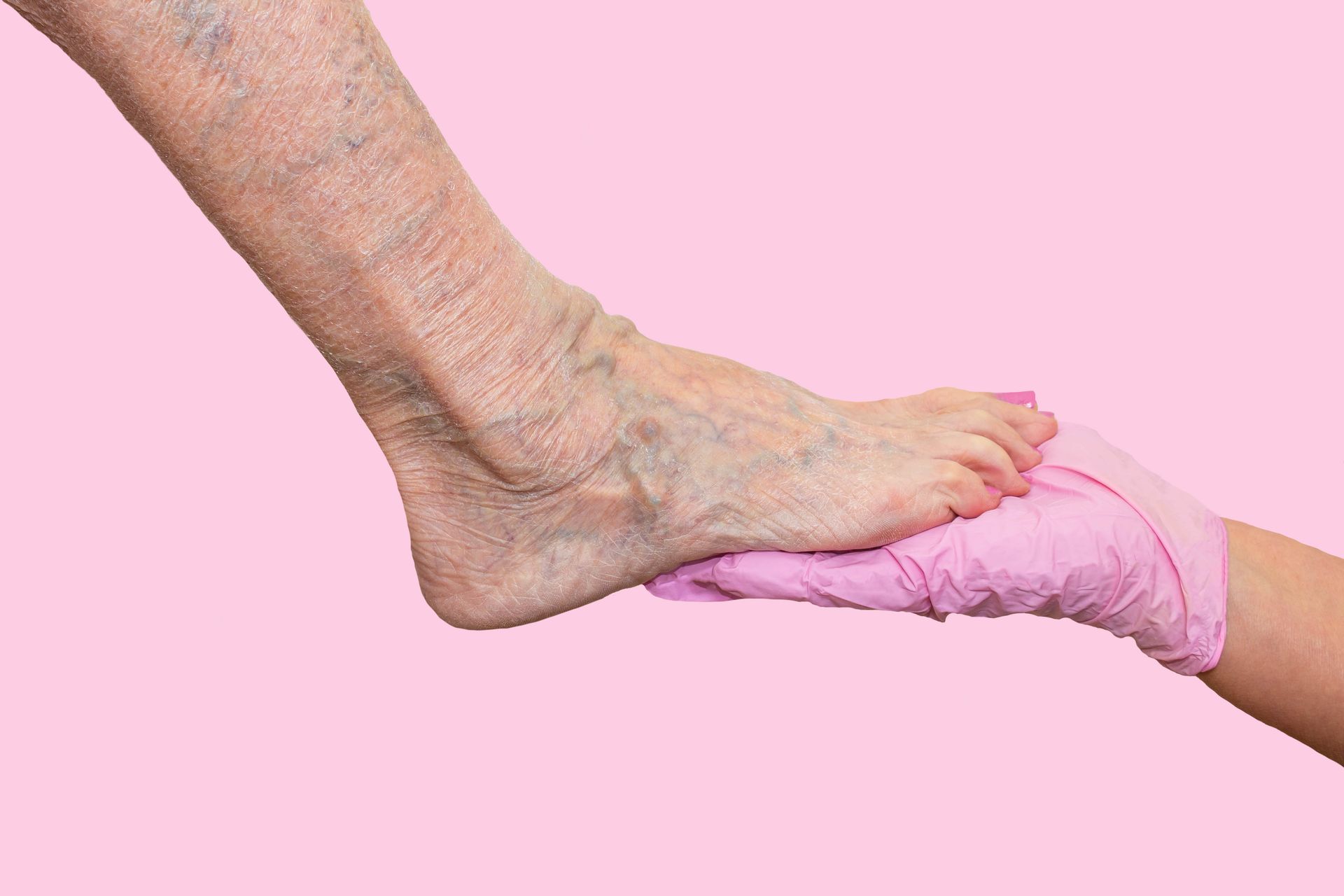 Foot massage with therapist’s hand supporting the heel.