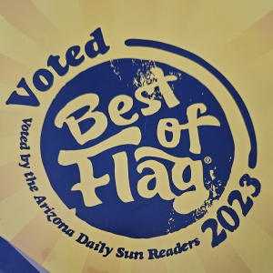 Best of the Flag 2023 circular blue-and-gold award emblem with “Voted by the Arizona Daily Sun Readers” text