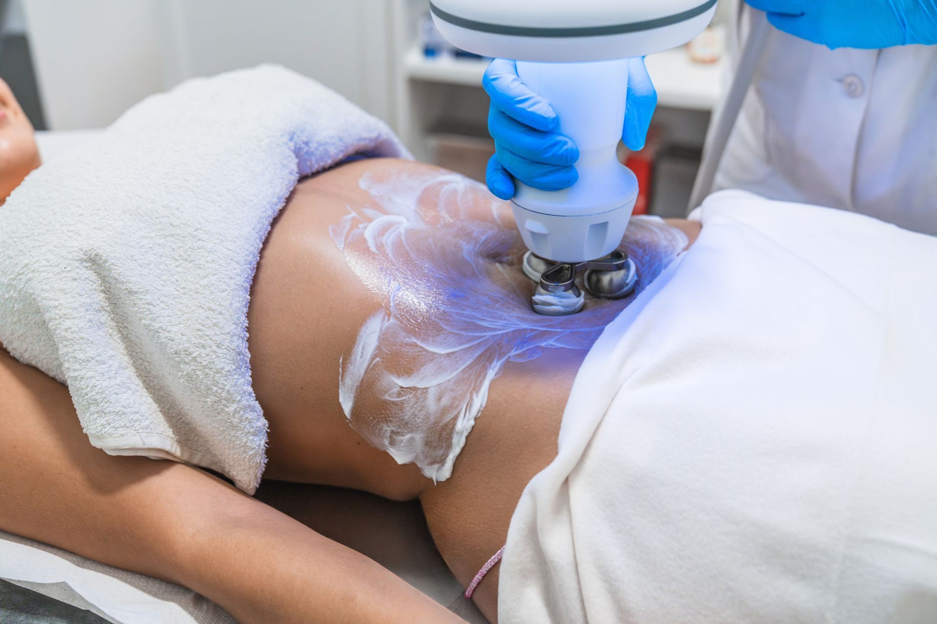 A woman is getting body contouring. A woman is getting body contouring.